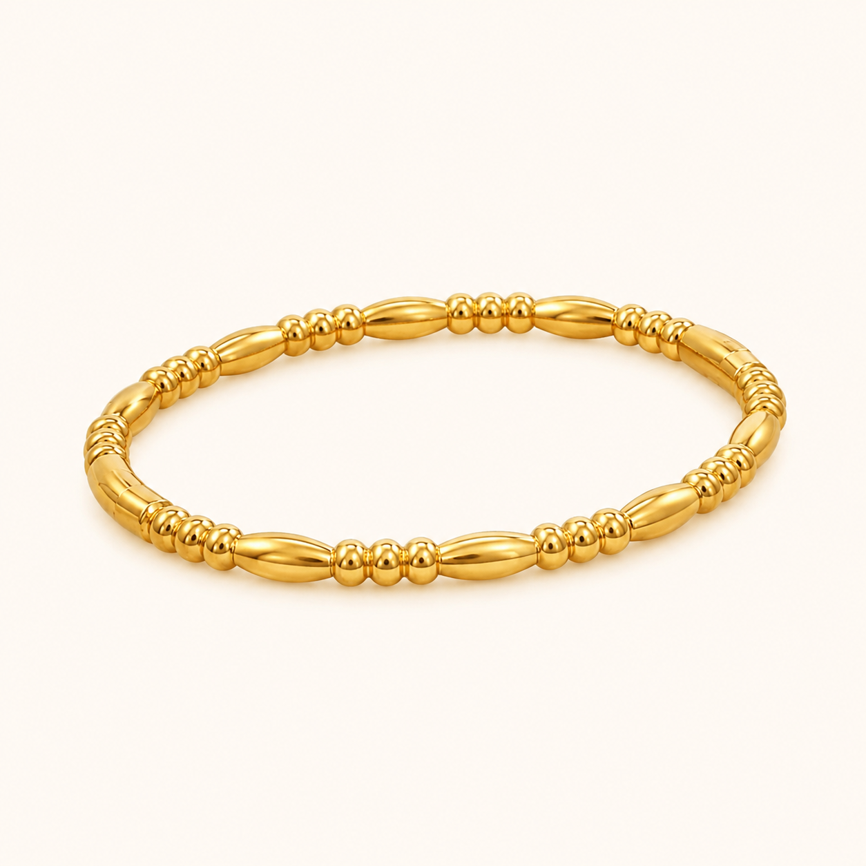 Gold bracelet on a white background